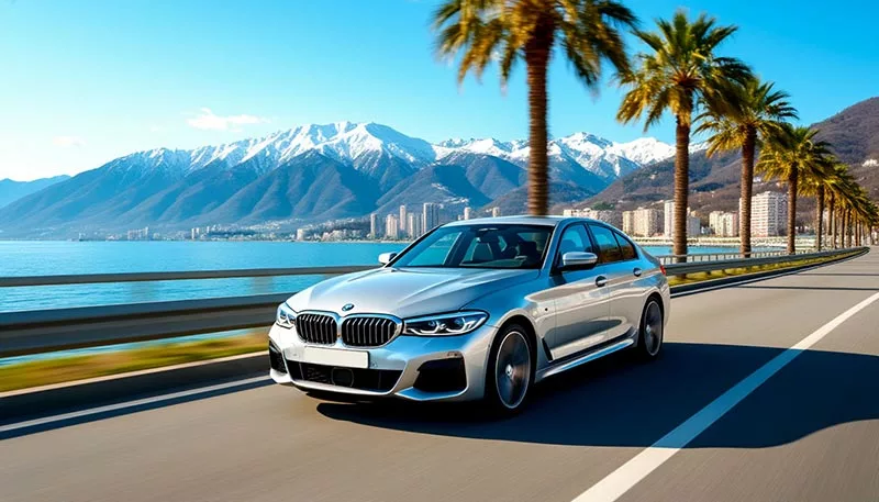 Rent a car in Sochi without a driver car on the highway by the sea